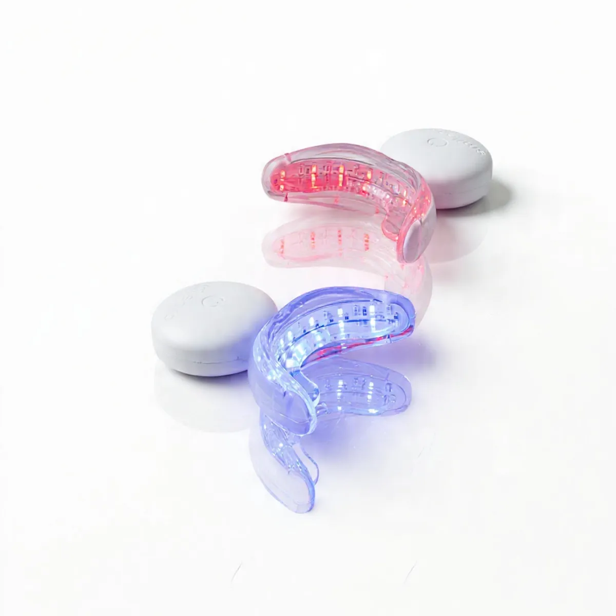 SmilePro LED mouthpieces lit blue and red